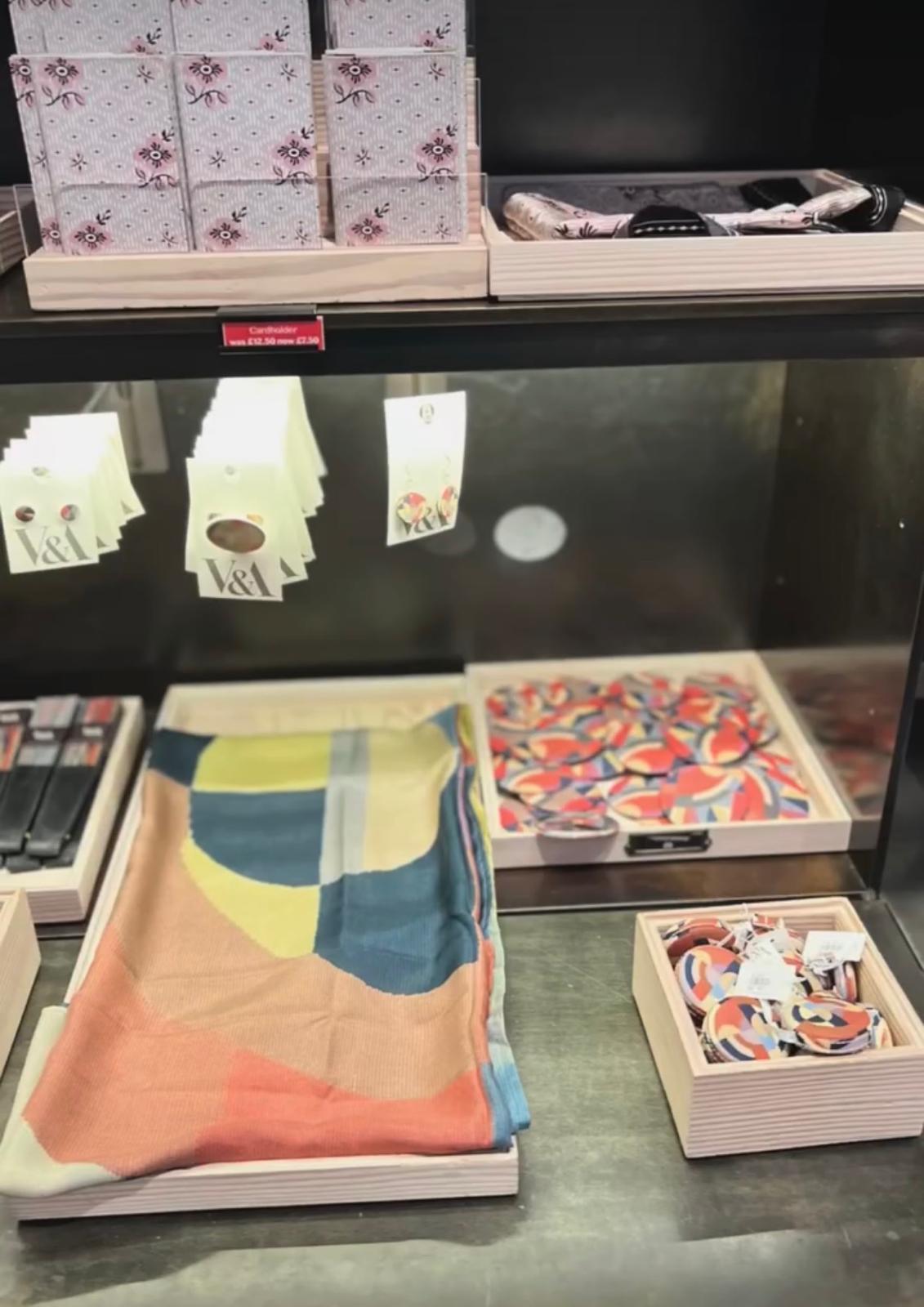 A range of heritage merchandise, from scarves to printed clothing, produced as one coherent collection.