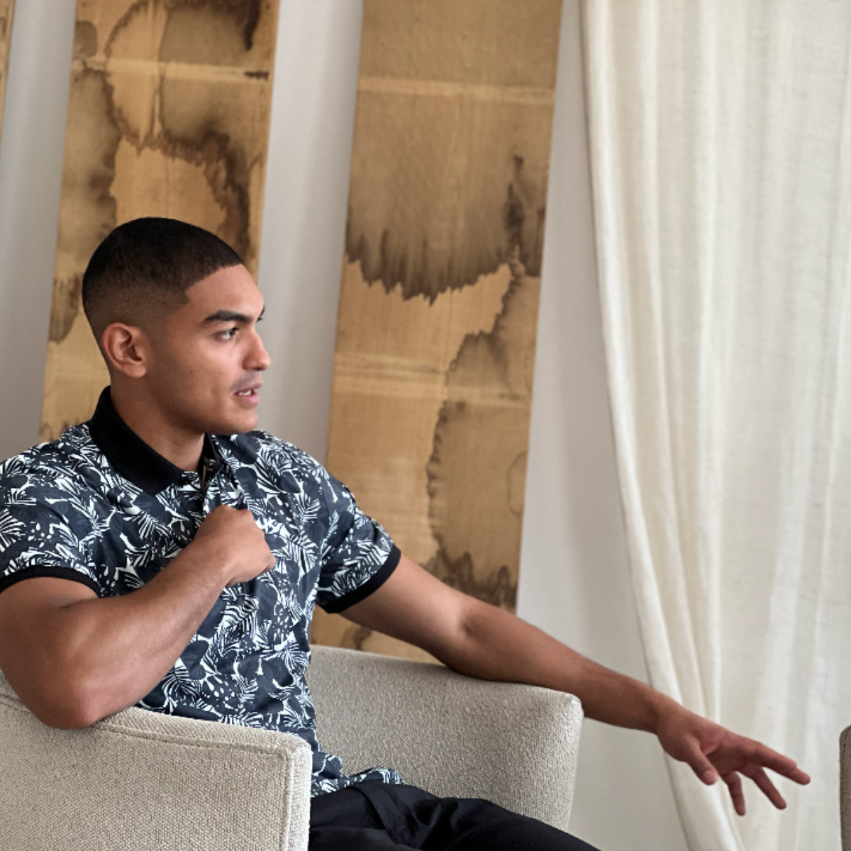 The DLK stars, lines and squares print developed in Adobe, shown across several placement options on the polo.