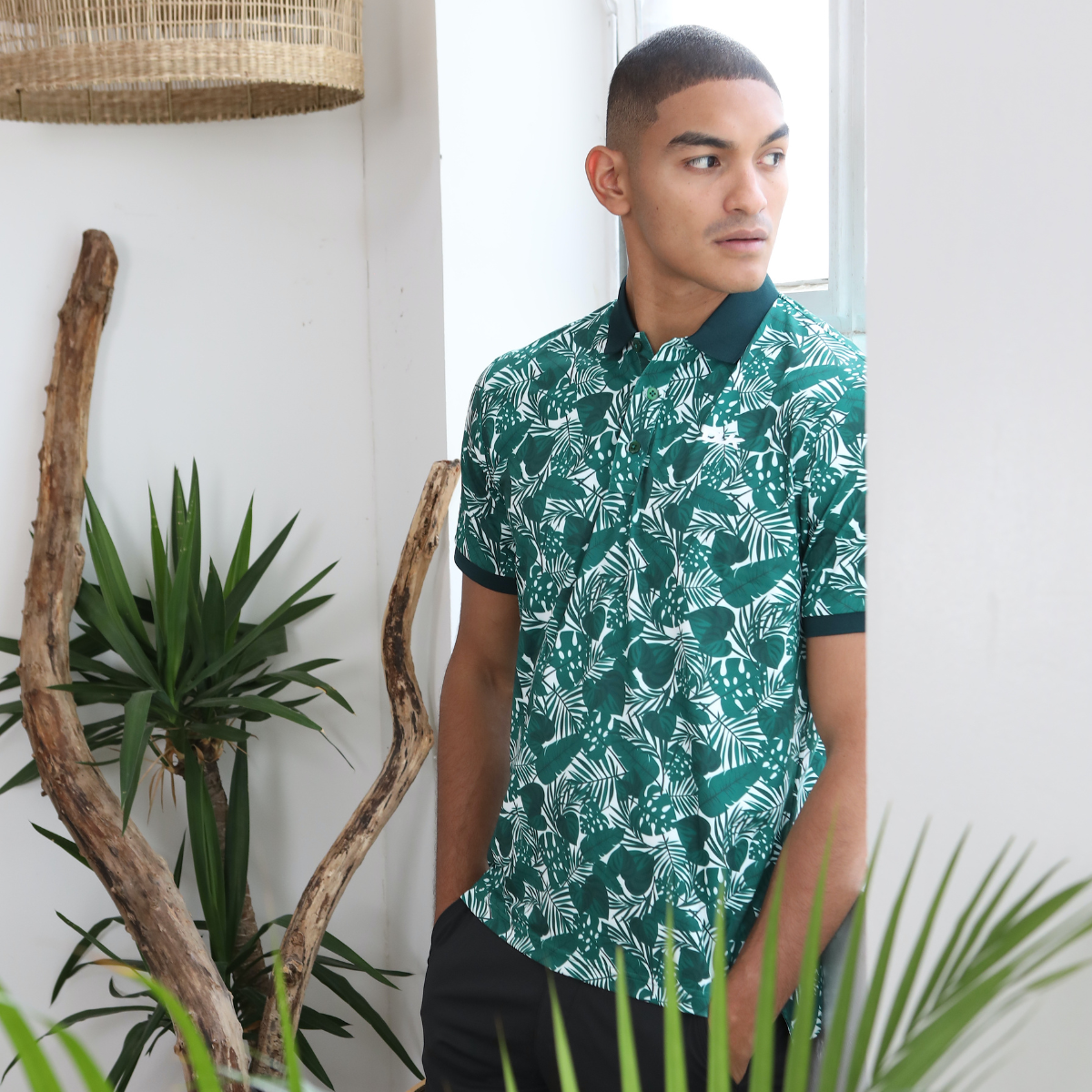 DLK sustainable golf polo with its stars, lines and squares print, photographed on the brand launch shoot.