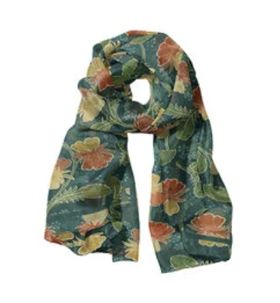 The Steiner & Co florals silk scarf draped, showing orange and yellow florals on deep green silk with flat-hemmed edges